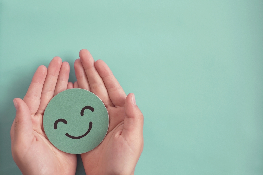 Smiley face symbolizing effects of employee wellness program