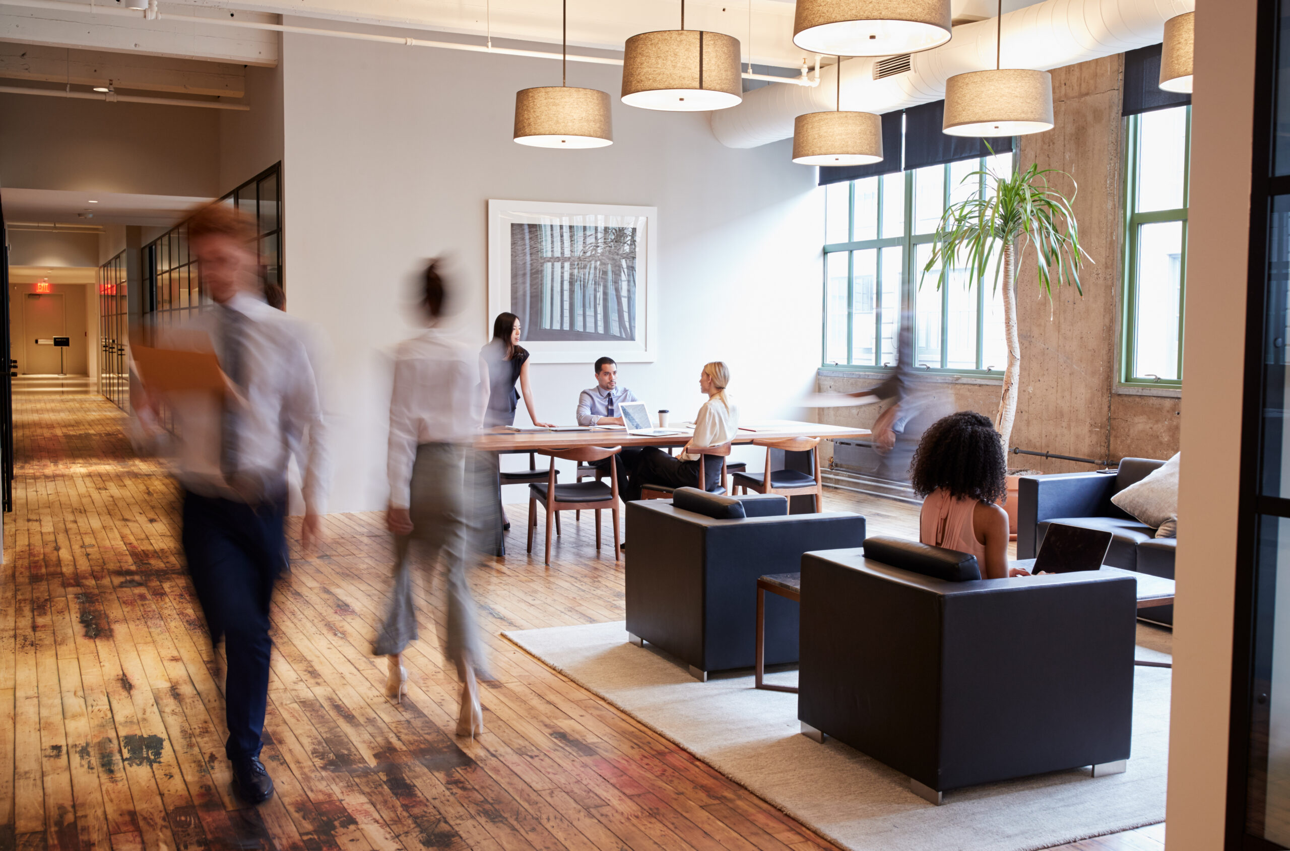 Busy luxury office space: People at work in a bustling business environment